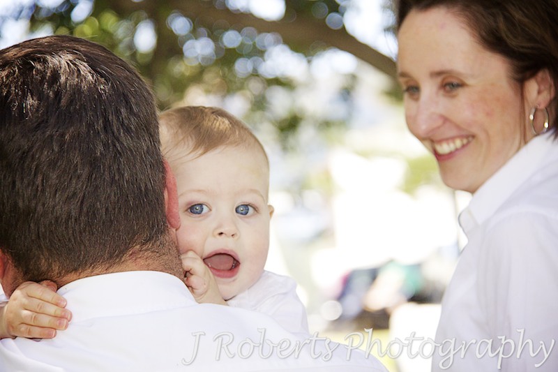 Baby boy giving dad a hug - family portrait photography sydney